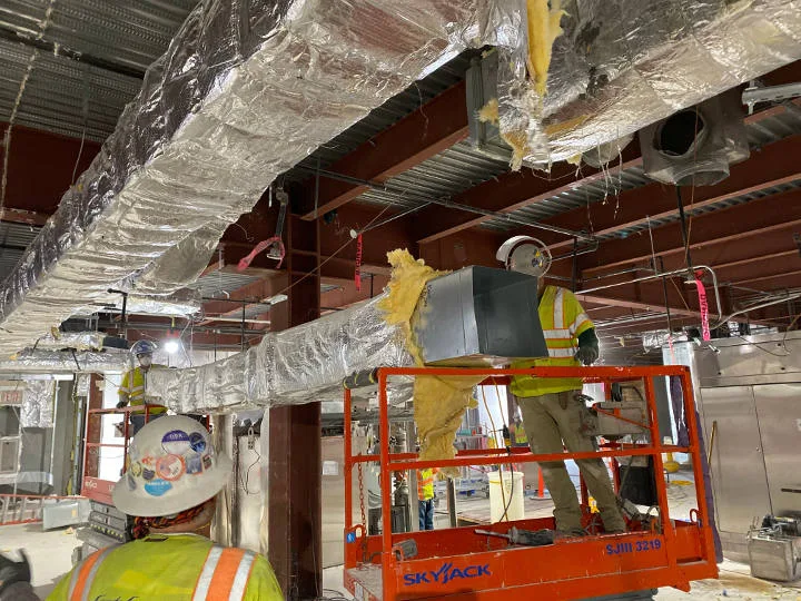 manlift removing ducting for takeda pharmaceuticals demolition project