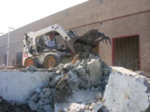 bobcat skid steer loader being used in nippon express usa demolition project
