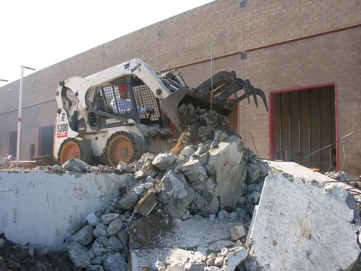 bobcat skid steer loader being used in nippon express usa demolition project